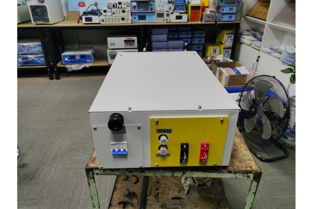 Close-up view of an industrial 15000A SCR-based power supply unit with robust forced-air cooling systems for desalination applications.